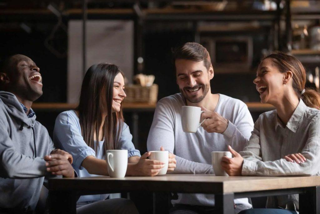 four colleagues having tea together